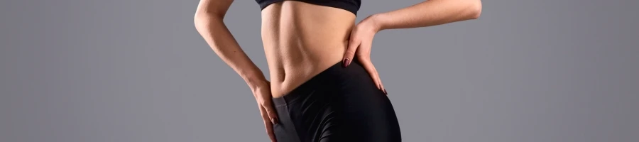 A woman showing her toned body