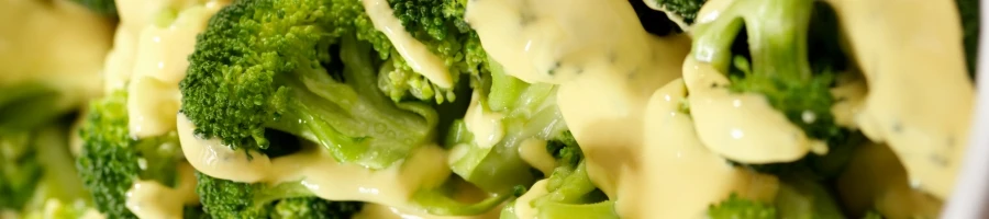 A broccoli with cheese sauce