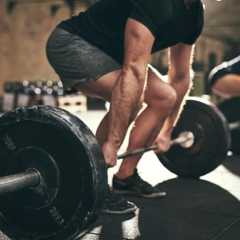 A man doing barbell deadlift
