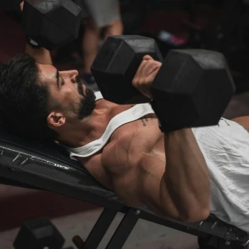 A man lifting dumbbells 