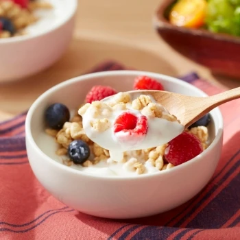 A yogurt and fruits for snack