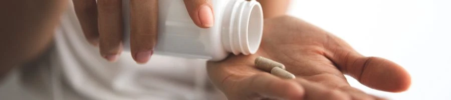 A person taking supplements