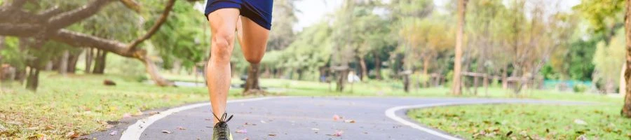 The man is running at the park