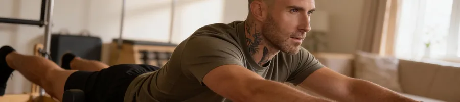 Adam doing pilates exercise