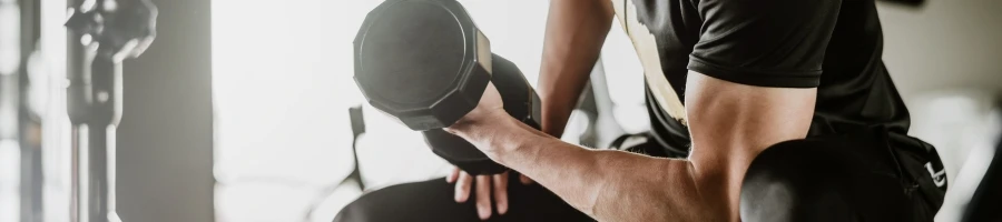 A guy doing dumbbell curls