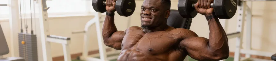 Blessing doing a shoulder press