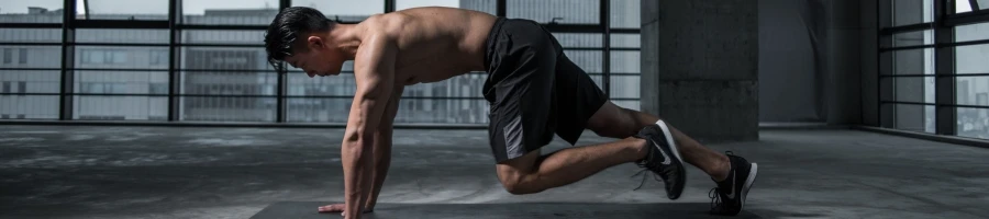 A man doing mountain climbers workout