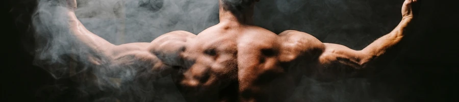 A guy showing his back muscles