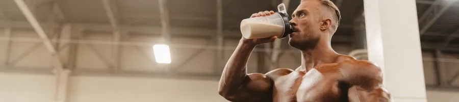 Chris taking a protein shake supplement