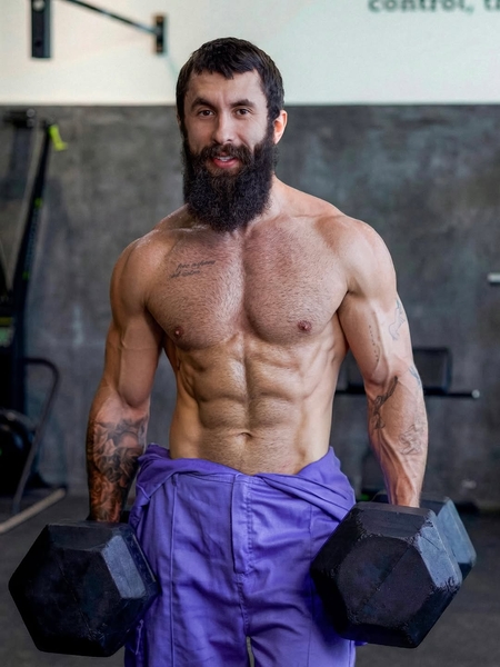 man holding dumbbells