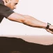 A person doing ballistic stretching before workout